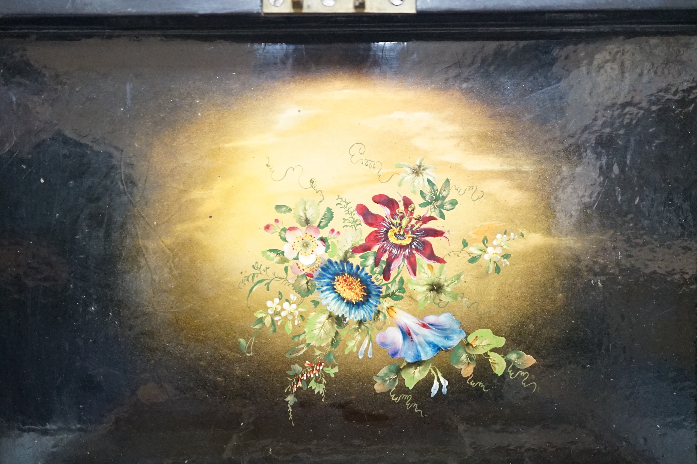 A Victorian painted papier-mâché sewing box, with peacock, blossom and gilt decoration with wooden inset, 30cms wide x 11cms high